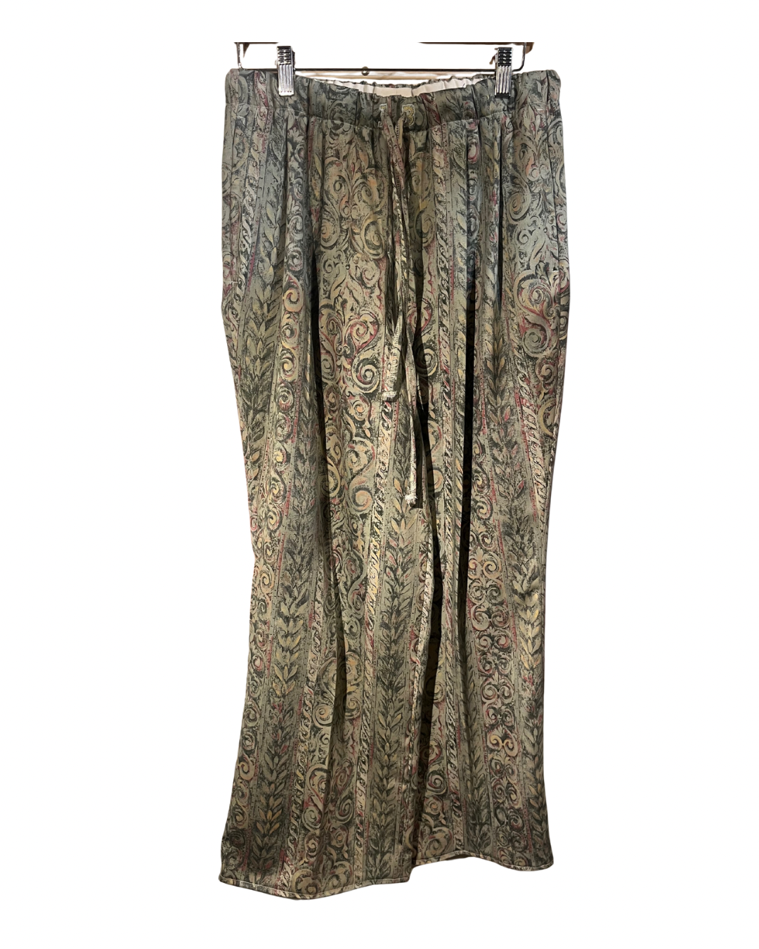 Patterned pants on a hanger against a white background