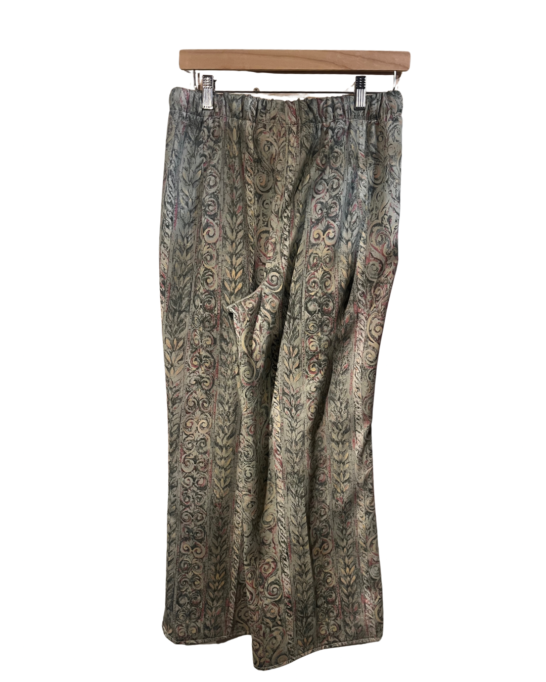Patterned skirt on a hanger against a white background