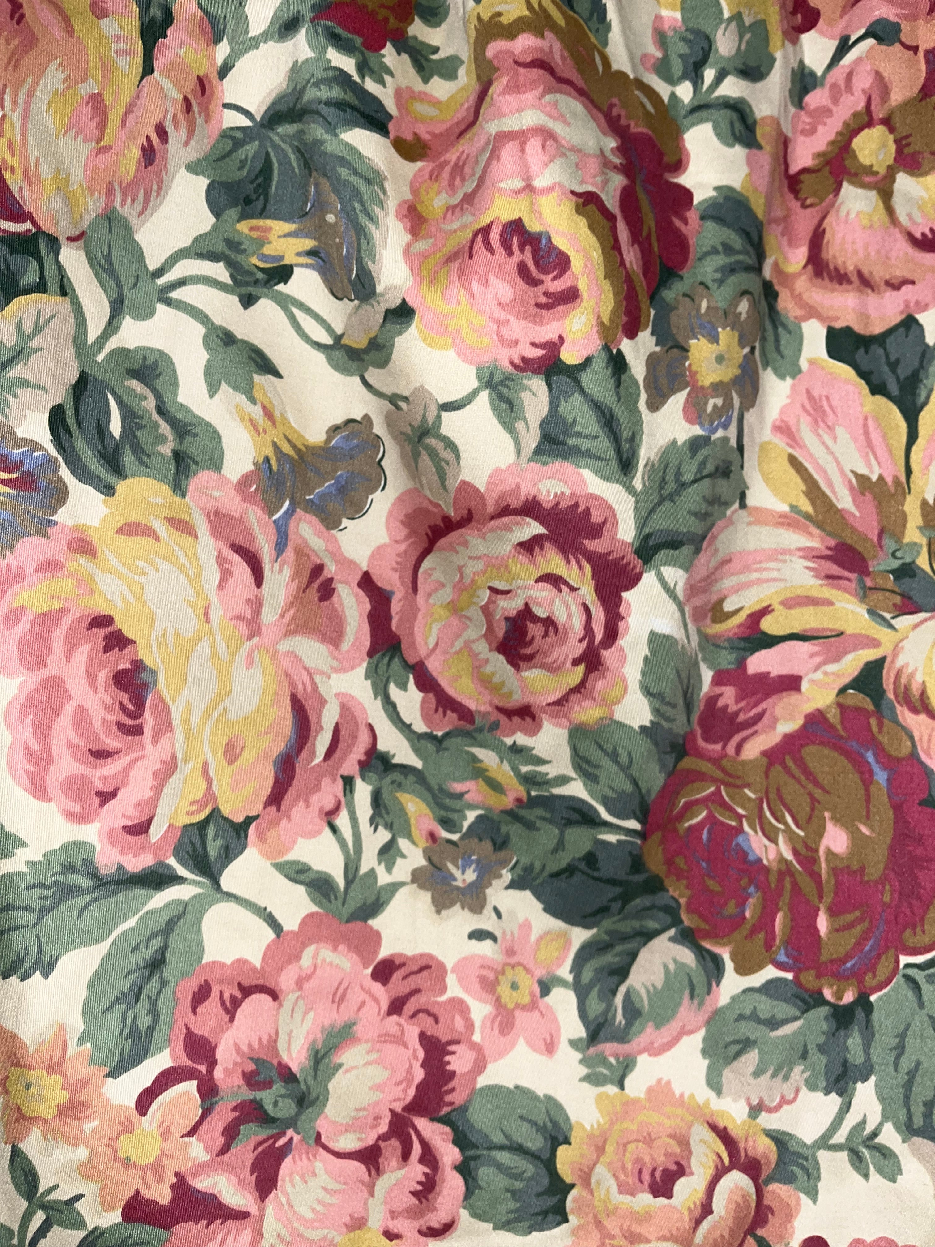 Floral pattern with pink and yellow flowers on a beige background