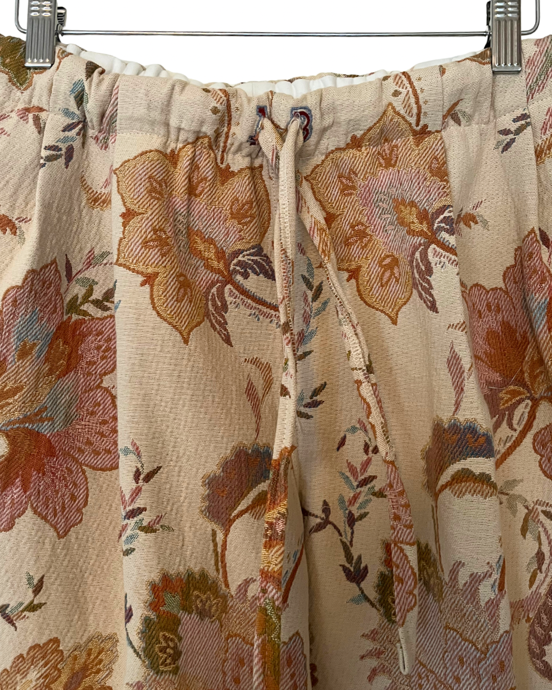 Floral patterned fabric hanging on a rack