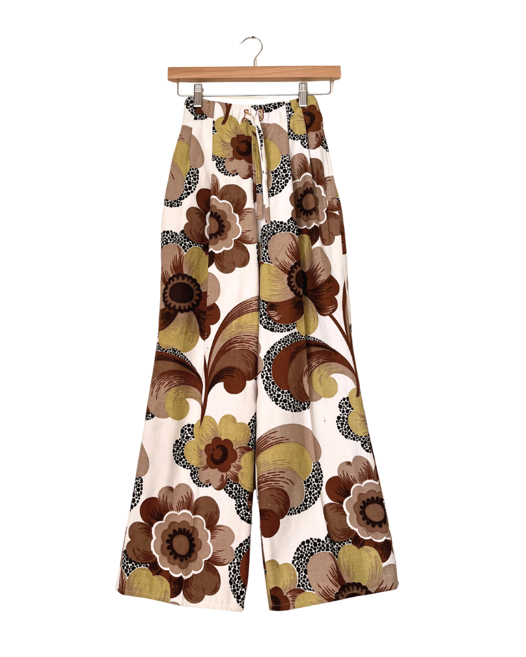 Handmade upcycled wide-leg trousers from vintage curtain fabric with bold 70s floral print in brown, mustard, and cream – sustainable fashion by JB’s