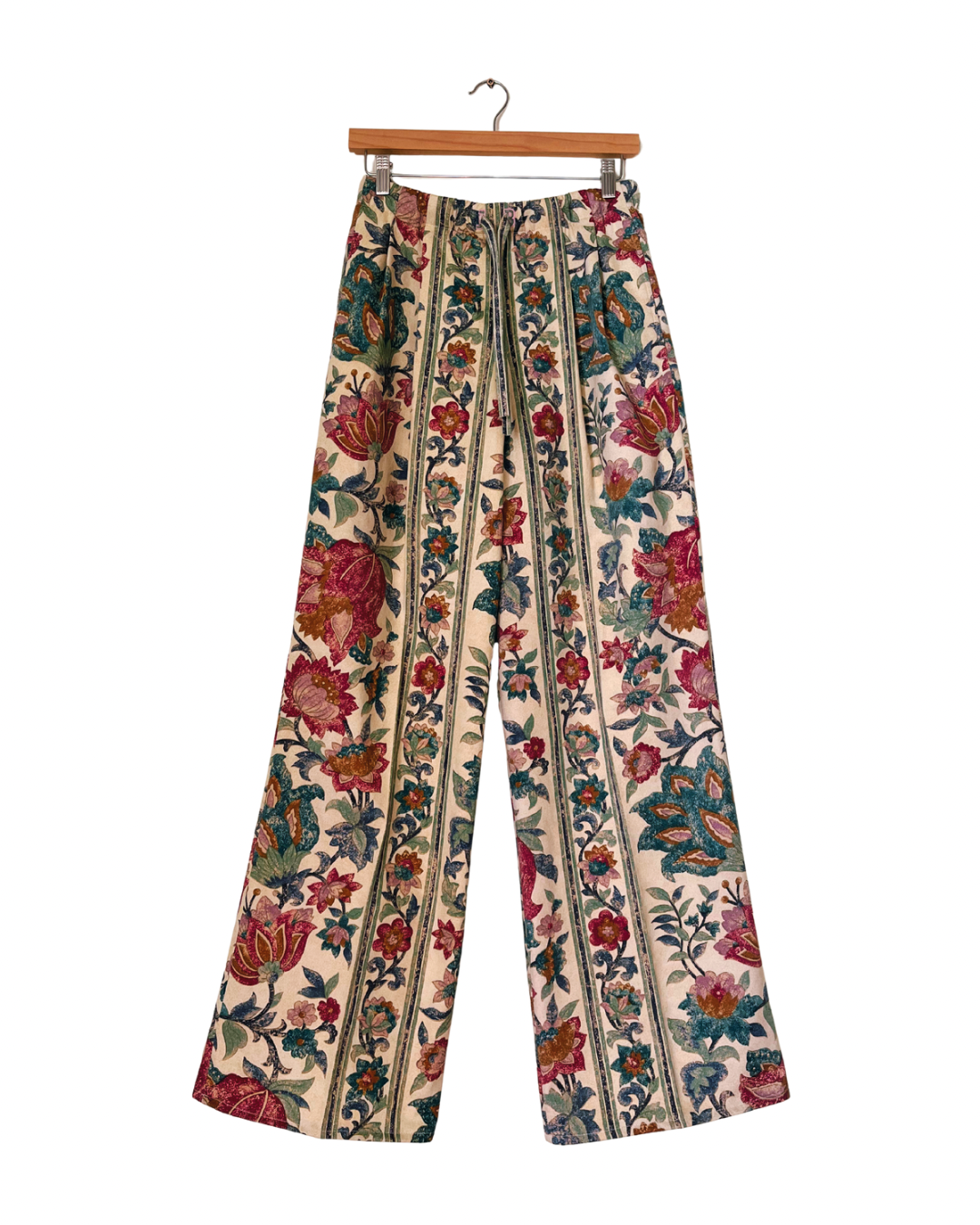 Handmade upcycled wide-leg trousers from vintage curtain fabric with striped floral design in red, teal, and cream – sustainable retro fashion by JB’s.