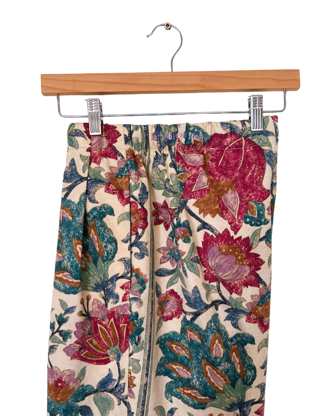 Handmade upcycled wide-leg trousers from vintage curtain fabric with striped floral design in red, teal, and cream – sustainable retro fashion by JB’s.